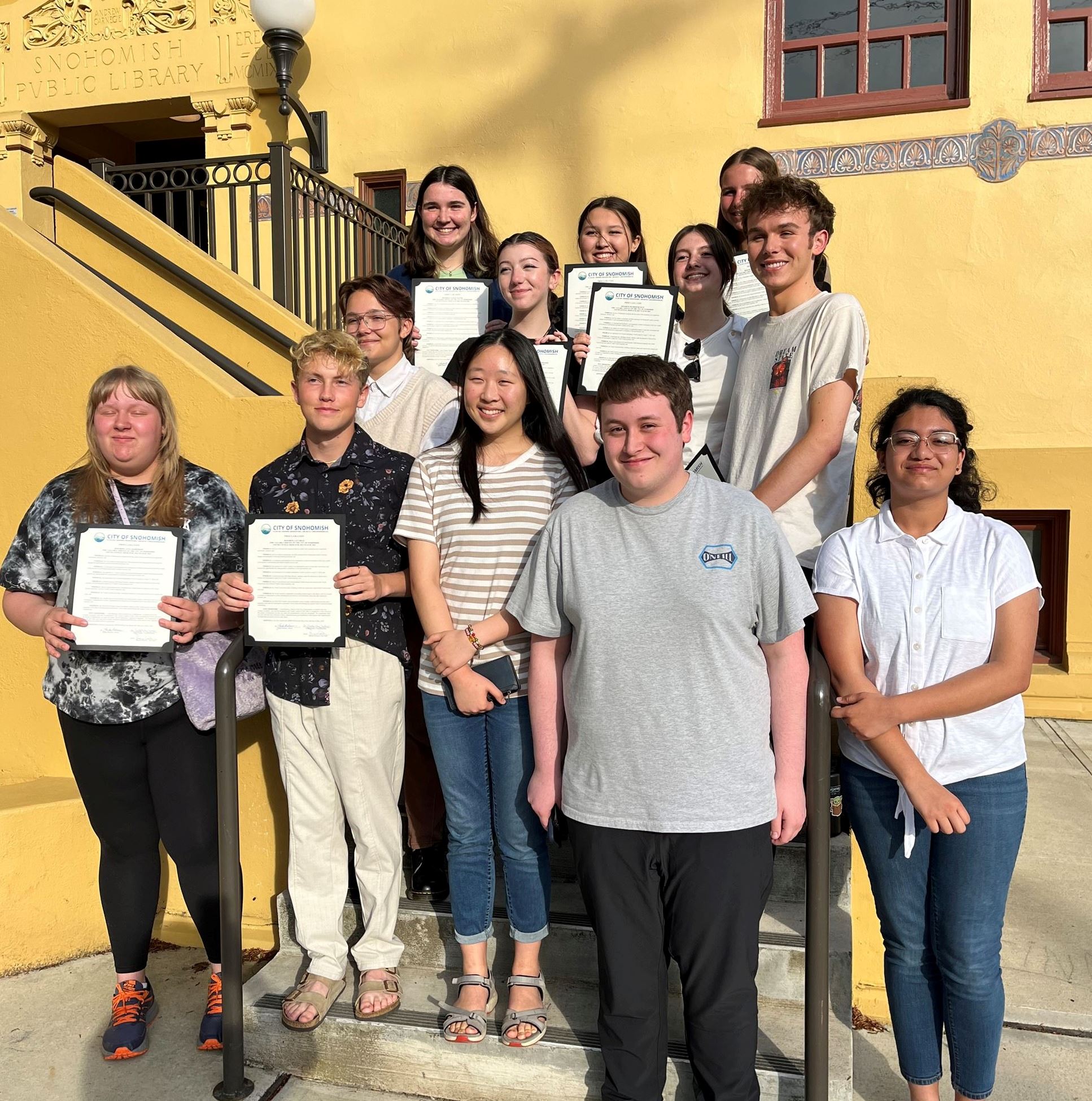 Photo of the 2023-24 Youth Council members in front of the Carnegie Building
